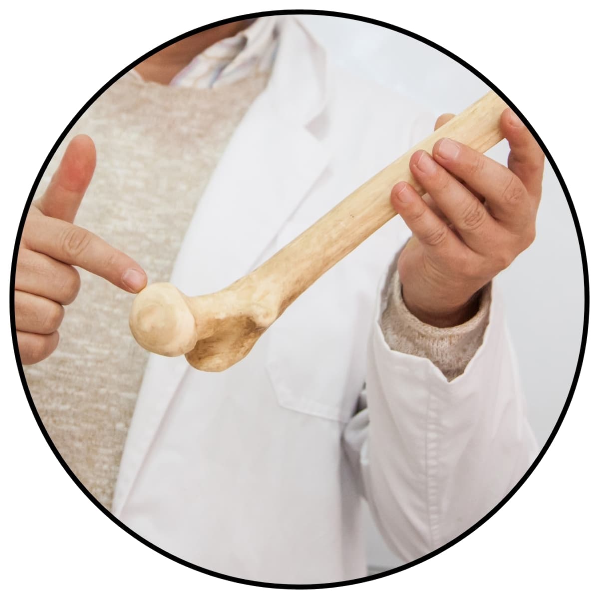 Photo of a man holding a bone within a circle frame for a post about bone jokes and bone puns.