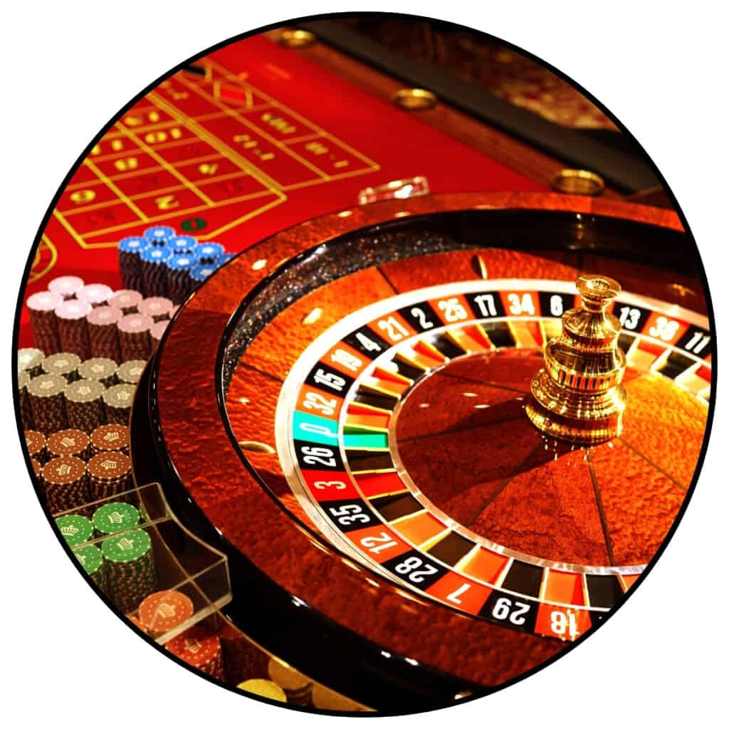 Image of casino roulette wheel within a circle frame for a post about casino jokes and casino puns.